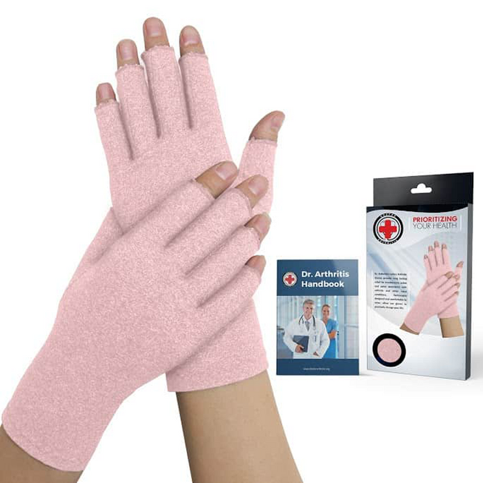 A pair of pink Dr. Arthritis Compression Crochet Fingerless Gloves next to a package.