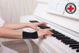 A woman playing a piano with Dr. Arthritis Copper Infused Wrist Sleeve [Single] support.