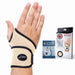 A hand wearing a Dr. Arthritis Copper Lined Wrist Support with its packaging and informational handbook displayed to the side.