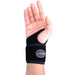 A woman's hand wearing a Dr. Arthritis Copper Lined Golf Wrist Brace [Single] for joint compression.