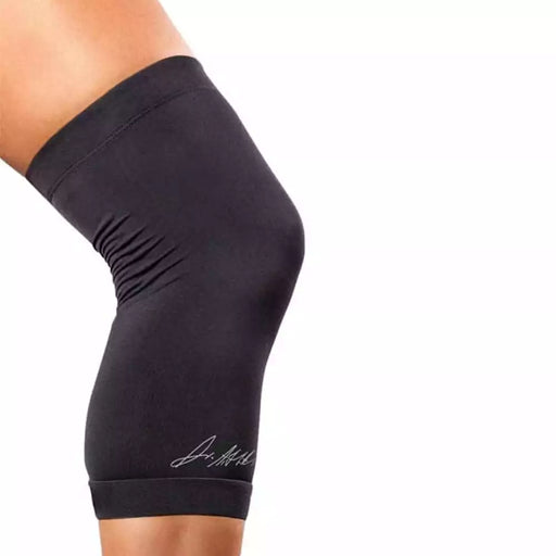 A woman wearing a Dr. Arthritis Copper Infused Knee Sleeve with a logo on it.