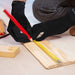 A person with arthritis is using Dr. Arthritis Copper Compression Gloves (Full-Fingered) to measure a piece of wood.