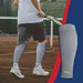 A man on a tennis court wearing a pair of Dr. Arthritis Calf Compression Sleeves for Men and Women.